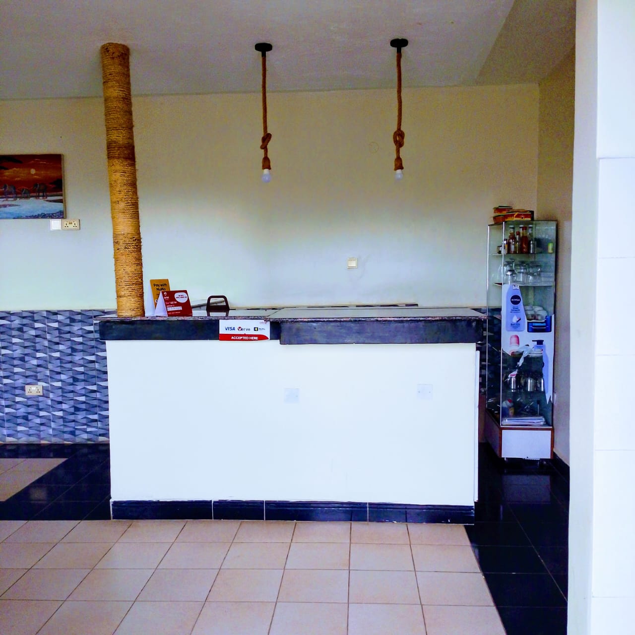 Akengyeya Country Hotel reception counter with welcoming check-in desk